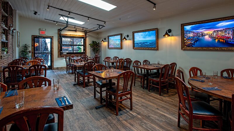 Side dining room with many set tables