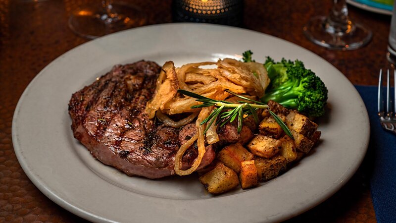 NY Strip steak with sauteed asparagus, rosemary roasted potatoes, finished with fig glaze